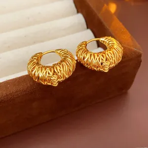 Vintage style chunky gold hoop earrings with an intricate wire-wrapped texture
