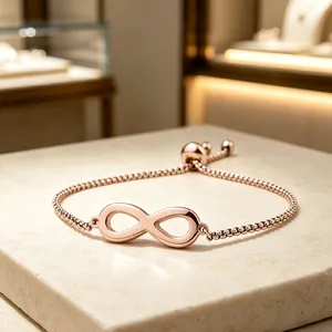Detailed view of a rose gold infinity symbol bracelet featuring an adjustable box chain