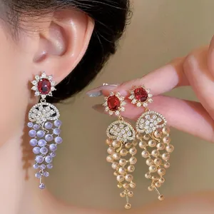 Elegant 18k gold plated zircon tassel earrings with red gemstone and grape beads