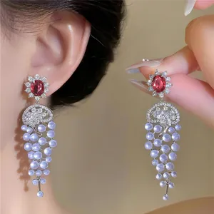Elegant 18k gold plated zircon earrings featuring a delicate light purple pearl tassel