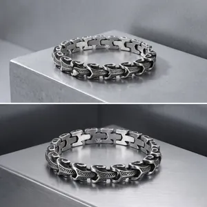 Detailed view of a vintage punk style dragon bone chain bracelet for men in stainless steel.