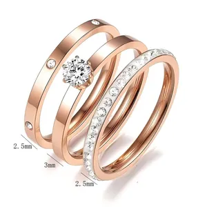 Detailed view of three-piece rose gold stainless steel ring set with zircon accents.