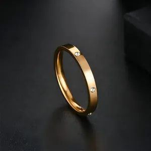 Close-up detail of a minimalist gold stainless steel ring with sparkling micro-set stones