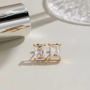 Close-up detail of rectangular emerald-cut cubic zirconia earrings in 18K gold setting