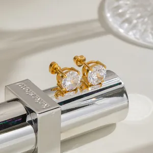 Detailed view of 18K gold-plated stainless steel stud earrings with clear cubic zirconia.