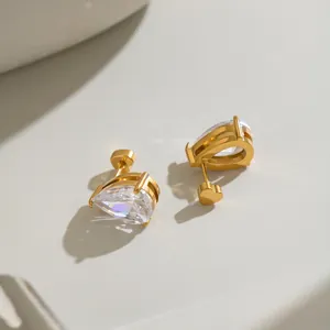 Detailed macro view of pear-shaped cubic zirconia stud earrings with 18K gold plating