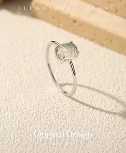 Close-up of elegant S925 sterling silver ring with an oval moss agate gemstone.