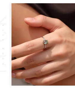 Close-up detail of sterling silver ring featuring a green moss agate gemstone
