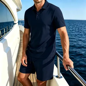 Detail shot of a premium navy blue ice silk polo and shorts set for men on a sunny yacht deck