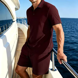 Detailed view of men's burgundy ice silk polo shirt and shorts set on a luxury yacht deck