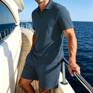 Premium men's ice silk polo shirt and matching shorts set in teal blue on a luxury yacht deck