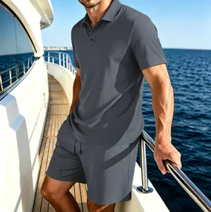 Detailed lifestyle view of men's gray ice silk polo and shorts set on a yacht deck