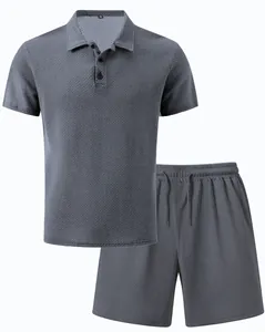 Detail view of a men's gray mesh polo shirt and matching shorts summer set with waffle texture