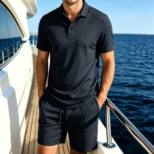 Detail view of navy blue mesh texture on men's summer polo and shorts set.