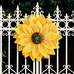 Large vibrant yellow mesh sunflower wreath for seasonal front door and wall decoration.