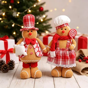 Pair of festive gingerbread man plush dolls in Christmas outfits for holiday home decoration