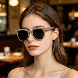 Modern chic taupe cat-eye polarized sunglasses for women in a lifestyle cafe setting