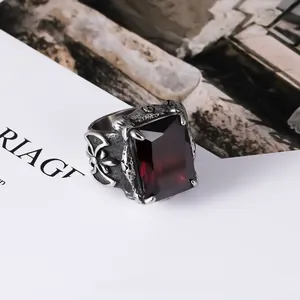 Vintage men's titanium steel ring featuring a large emerald-cut red gemstone