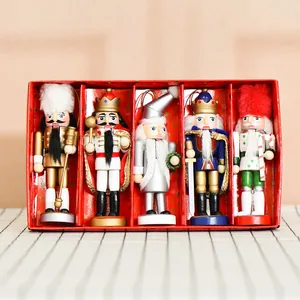 A festive set of five decorative 13cm wooden Nutcracker soldier ornaments in a red gift box