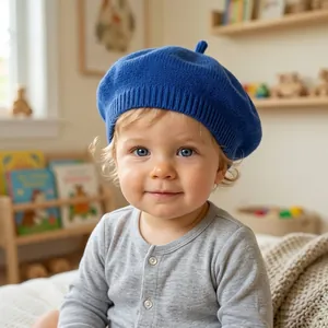 Close-up of a cozy blue knitted beret on a toddler in a bright and warm nursery.