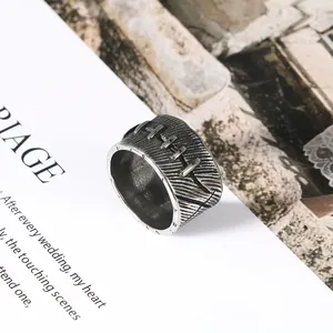 Close-up of vintage stainless steel ring with unique stitched suture pattern detail