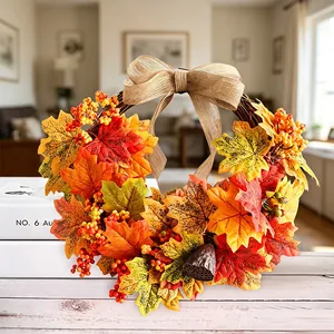 Autumn maple leaf wreath with linen bow and berries for Thanksgiving decor