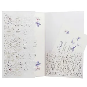 Elegant white laser-cut wedding invitation set featuring purple floral details