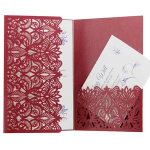 Elegant red laser-cut wedding invitation card with intricate hollow floral design