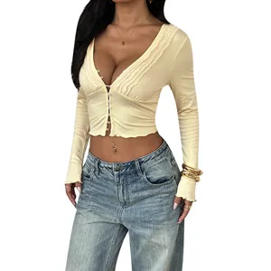 Sexy deep V-neck ruched long sleeve crop top in light yellow, slim fit design for women.