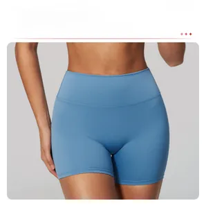Close-up of blue high waisted yoga shorts featuring a tight fit and seamless design