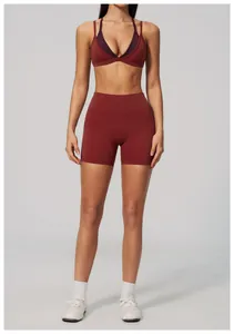 Two-piece burgundy yoga set featuring a sports bra and high waisted fitness shorts