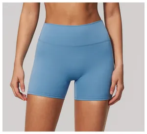 Detail view of women's blue high-waisted yoga shorts featuring soft nude feel fabric