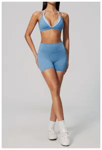 Model wearing light blue high-waist naked-feel yoga shorts and matching sports bra