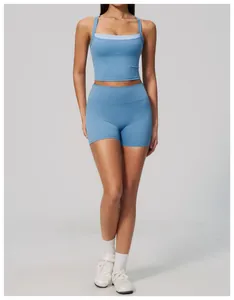 Detail of women's light blue high-waisted yoga shorts and tank top set for fitness