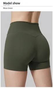 Close-up back view of high-waisted moss green compression yoga shorts on female model.