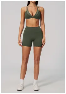 Close-up of high-waisted olive green yoga shorts and sports bra set for women