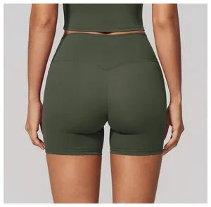 Back view detail showing the lifting fit of high-waisted olive green yoga shorts for women