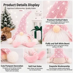 Detail view of pink knitted Christmas gnome decoration showing soft fabric and beard textures
