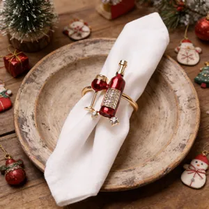 Detailed macro shot of creative red wine bottle and glass napkin ring on a white napkin