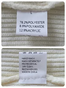 Close-up detail of care label for men's white knit cardigan showing material composition