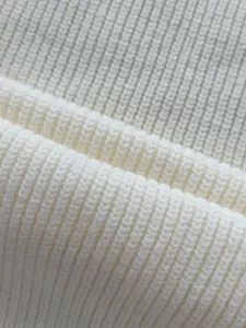 Macro view of soft white ribbed knit fabric texture for classic men's winter sweater