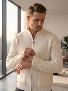 Detailed view of a cream ribbed knit cardigan sweater with a zipper and stand collar