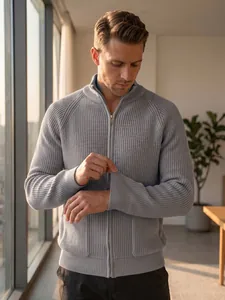 Detailed shot of a grey ribbed knit cardigan for men with stand collar and zipper