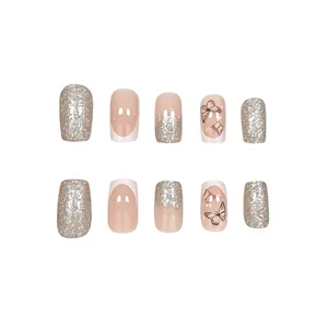 Detail view of French press-on nails with silver glitter and butterfly patterns