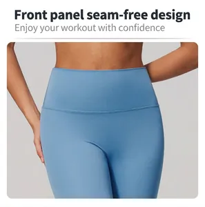 Detail of blue high waist yoga pants with seamless front design for workout fitness.