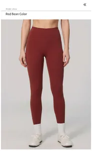 Close-up detail of high-waisted reddish-brown compression yoga pants for women's fitness