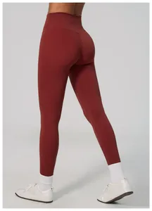 Professional rear view of high-waisted rust red lifting yoga pants for women gym