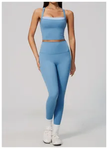 Professional blue high-waisted yoga leggings and matching sports bra for gym fitness
