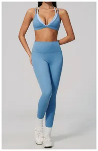 Professional studio shot showcasing the fit and texture of light blue athletic leggings.