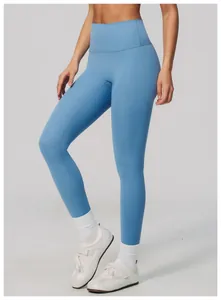 Side view detail of high-waisted blue yoga leggings showing snug fit and butt-lifting design